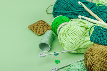 A set of knitting yarn and tools in spring colors. Handmade concept, creative art, crafting process