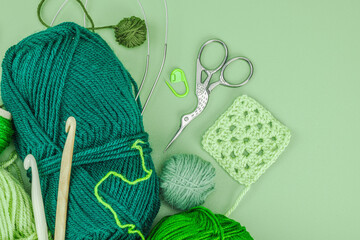 A set of knitting yarn and tools in spring colors. Handmade concept, creative art, crafting process