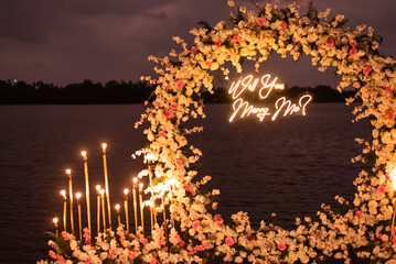 Will you marry me lights with flower decoration landscape