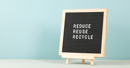 Black letter box with eco friendly motivational quote on blue background.