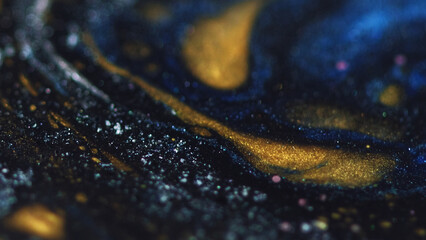 Glitter paint blend. Marble texture. Defocused blue golden black color sparkling wet ink layers...