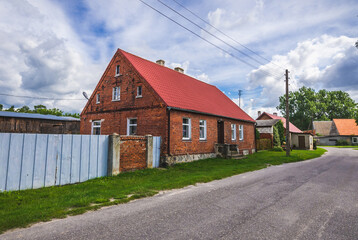Fototapeta na wymiar Road and houses in Mielenko Gryfinskie village, Poland