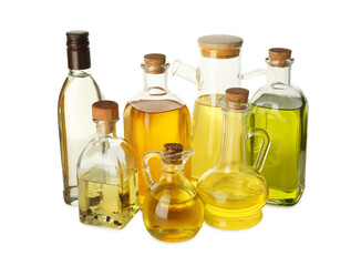 Vegetable fats. Glassware of different cooking oils isolated on white