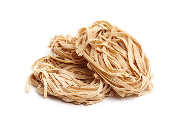 Whole grain pasta tagliatelle isolated on white background. Tagliatelle integrali, wholemeal pasta