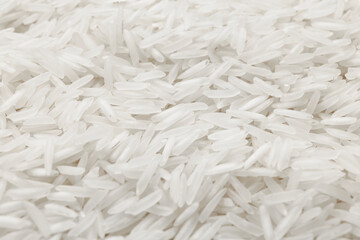 Raw basmati rice as background, closeup view