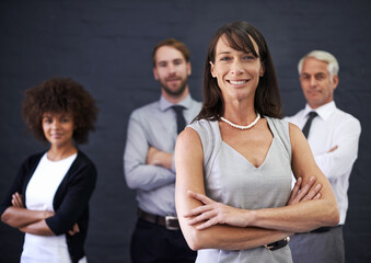Business people, leadership and arms crossed for teamwork, confidence and about us on a wall...