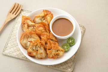 Batagor, made from fish or chicken dumpling, tofu, tapioca flour served with peanut sauce. Indonesian food
