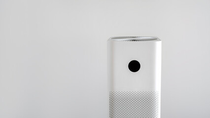 New air purifier in living room standing isolated on white copy space background