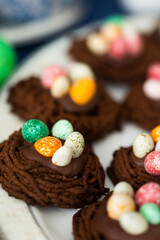 Holiday Easter homemade cookies in shape of nests with colorful sugar eggs