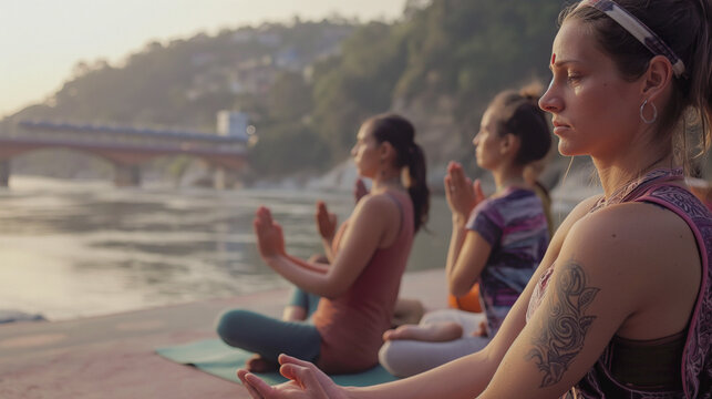 Yoga Retreat by the Ganges in Rishikesh, A serene yoga session overlooking the tranquil Ganges river at sunrise in Rishikesh, India