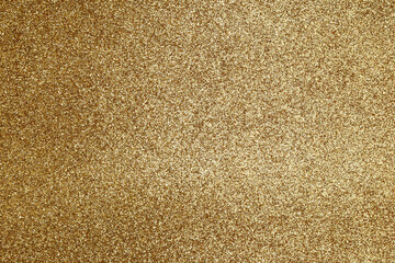 Gold texture. Golden background with effect metallic foil. Speckles gold material. Speckled glitter backdrop. Abstract shiny pattern. Shine metal plate for design invitation, cards, prints