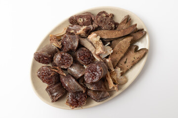 Sundae and pork intestines on white background