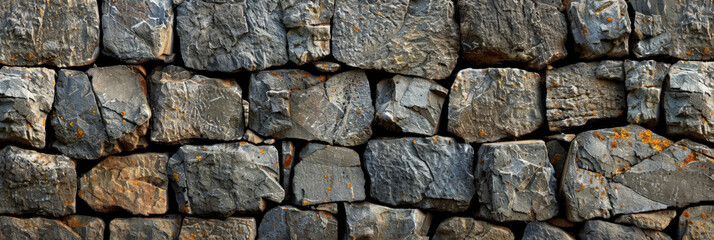 Fototapeta premium texture of stone walls. rectangular stones of various sizes and colors gray wall, old stone gray wall, banner