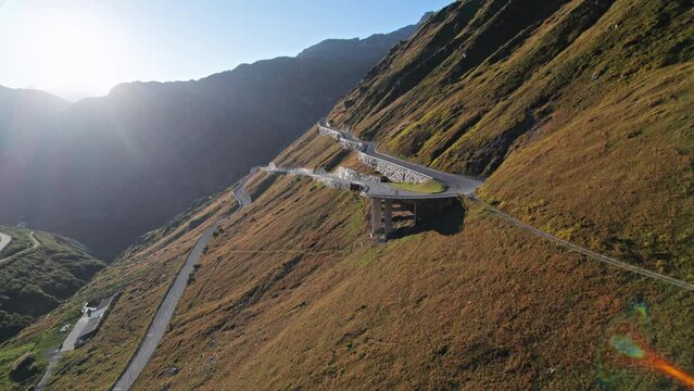 Aerial view of Furka Pass road at sunset, Switzerland.