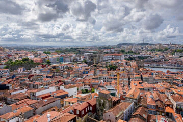 Fototapeta na wymiar Aerial view from tower of Clerigos Church in Porto city, Portugal with Se Cathedral, Douro River and Vila Nova de Gaia city