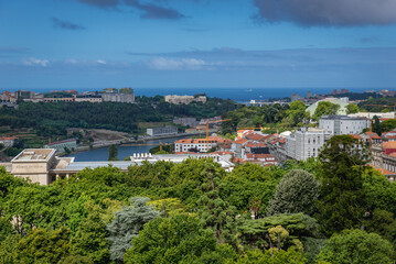 Fototapeta na wymiar Aerial view from tower of Clerigos Church in Porto city, Portugal with Douro river and Cordoaria park
