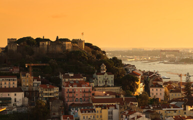 Saint George Castle (São Jorge Castle in Portuguese) during the sunset. Landscape with this...
