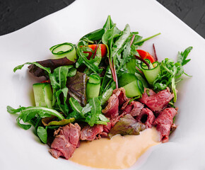 Meat Carpaccio with Rocket Salad on plate