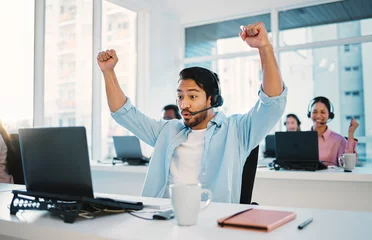  Call center, man and cheers at laptop for success, CRM bonus and winning promotion in coworking agency. Happy asian salesman celebrate achievement of deal, telemarketing profit and fist at computer © peopleimages.com