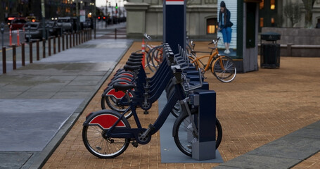 Generic Electric bicycle charging station. Shared electric bikes parked for rent on city street