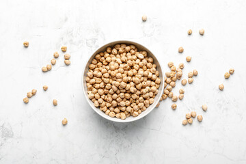Chickpea in a bowl on a white background, top view