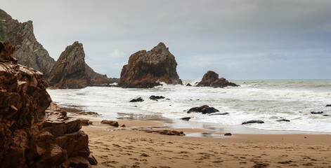Ursa Beach during a cloudy day without tourists. High res panoramic photo with this amazing landscape landmark next to Cabo da Roca in Lisbon, Portugal. Travel to Atlantic Ocean