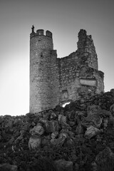 Black and white photograph of the ruins of the castle in the abandoned town of Caudilla, Toledo...