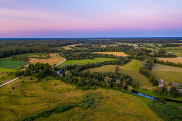 Fototapeta na wymiar Summer rural landscape in the evening with beautiful sky, aerial view.