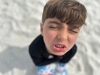 boy making funny faces distorted 