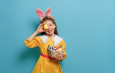 Girl with painted eggs.