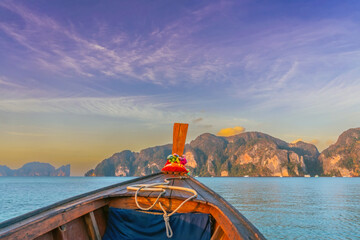 Morning sunrise Boat sails to islands and rocks, Maya Bay, Phi Phi Le Island, Thailand