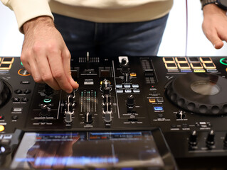 disc jockey working with a mixing table