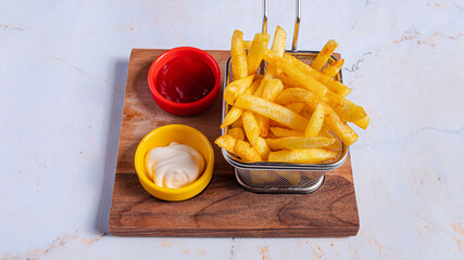 Fries basket, ketchup and mayonnaise