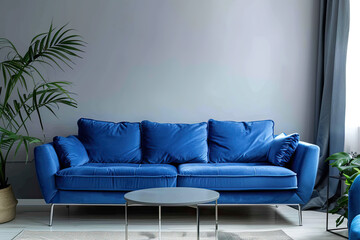 blue sofa in living room with empty wall