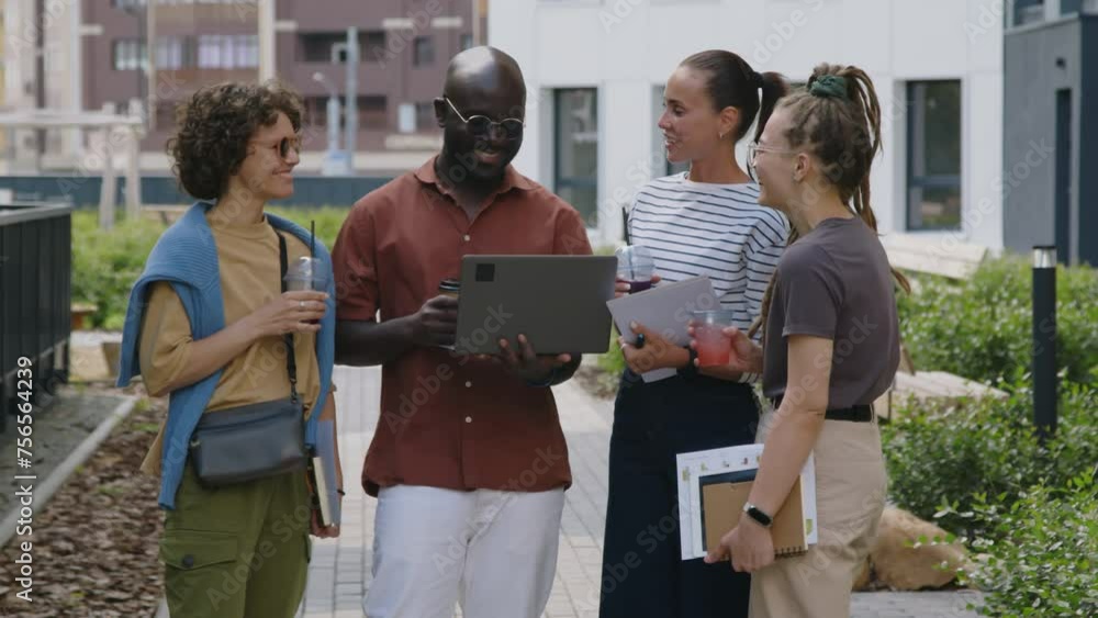 Poster full medium footage of group of diverse business colleagues talking happily while discussing success