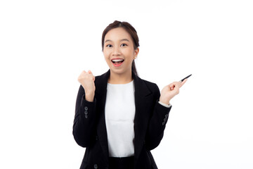 A cheerful young asian businesswoman in a suit, smiling and looking up, holding a pen, celebrating...