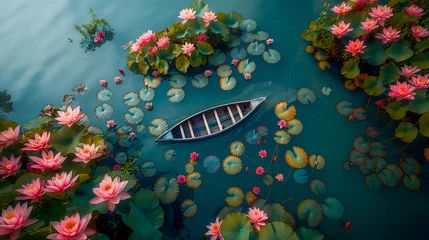 Selbstklebende Fototapeten Top view of a boat on the lake with lotus flowers. © Nutchanok