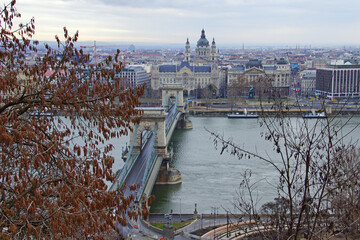 beautiful view of Chain Secheny Bridge over Danube River, Gresham Palace and Saint Stephen's Basilica from Buda Castle on sunny summer day. UNESCO World Heritage Site