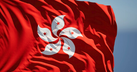 Close-up of the national flag of Hong Kong flutters in the wind on a sunny day