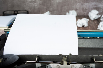 Blue typewriter with paper sheet. Space for your text.