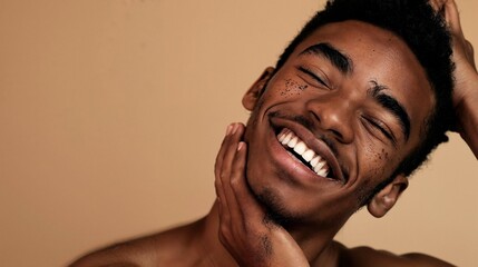 Joyful young man with freckles smiling with confidence. Portrait of happiness and self-acceptance with a focus on skincare - obrazy, fototapety, plakaty