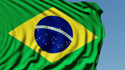 Close-up of the national flag of Brazil flutters in the wind on a sunny day