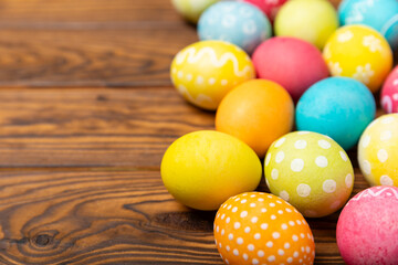 Easter eggs on a bright background. Easter celebration concept. Colorful easter handmade decorated Easter eggs. Place for text. Copy space.
