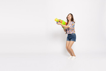 Young Asian woman in summer outfits holding water guns plastic for Songkran festival in Thailand...