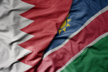 big waving national colorful flag of namibia and national flag of bahrain.