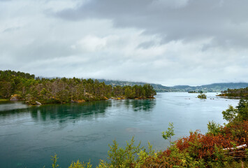 Summer cloudy fjord landscape (Norway).