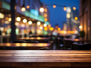 Naklejka premium Wooden cafe table bokeh background, empty wood desk, restaurant tabletop counter in a bar or coffee shop surface product display mockup with blurry city lights backdrop presentation. Mock-up