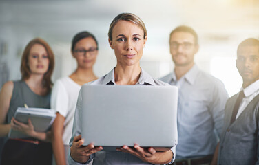 Portrait, team leader and business woman with laptop in office, workplace or company together. Face, computer and professional group of employees, entrepreneur and consultants with collaboration