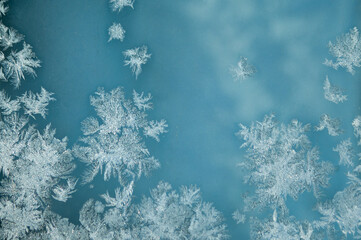 ice pattern on glass and blue background