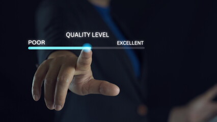 Obraz premium Businessman hand pointing to change quality level indicator scale from poor to excellent for customer satisfaction and evaluation concept.